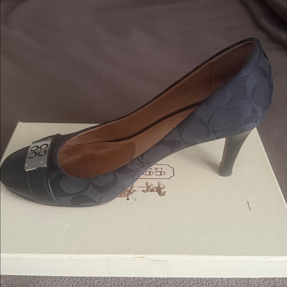 Coach black leather heel with silver front toe plate